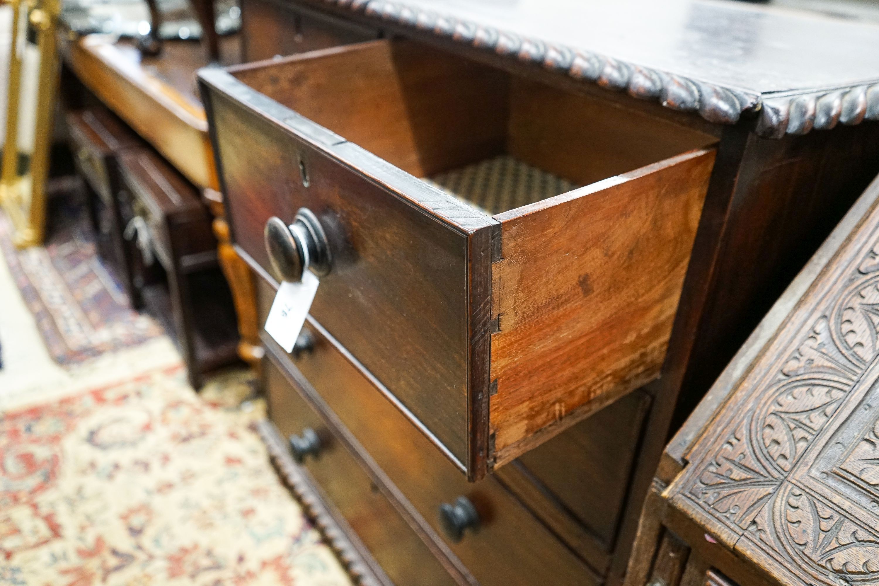 A 19th century Anglo Indian padouk two part chest with gadrooned decoration, width 96cm, depth 43cm, height 106cm